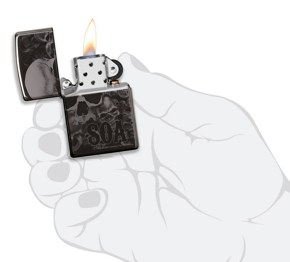 Front shot of Zippo Bejeweled Beetle Design High Polish Brass Windproof Lighter standing at a 3/4 angle.