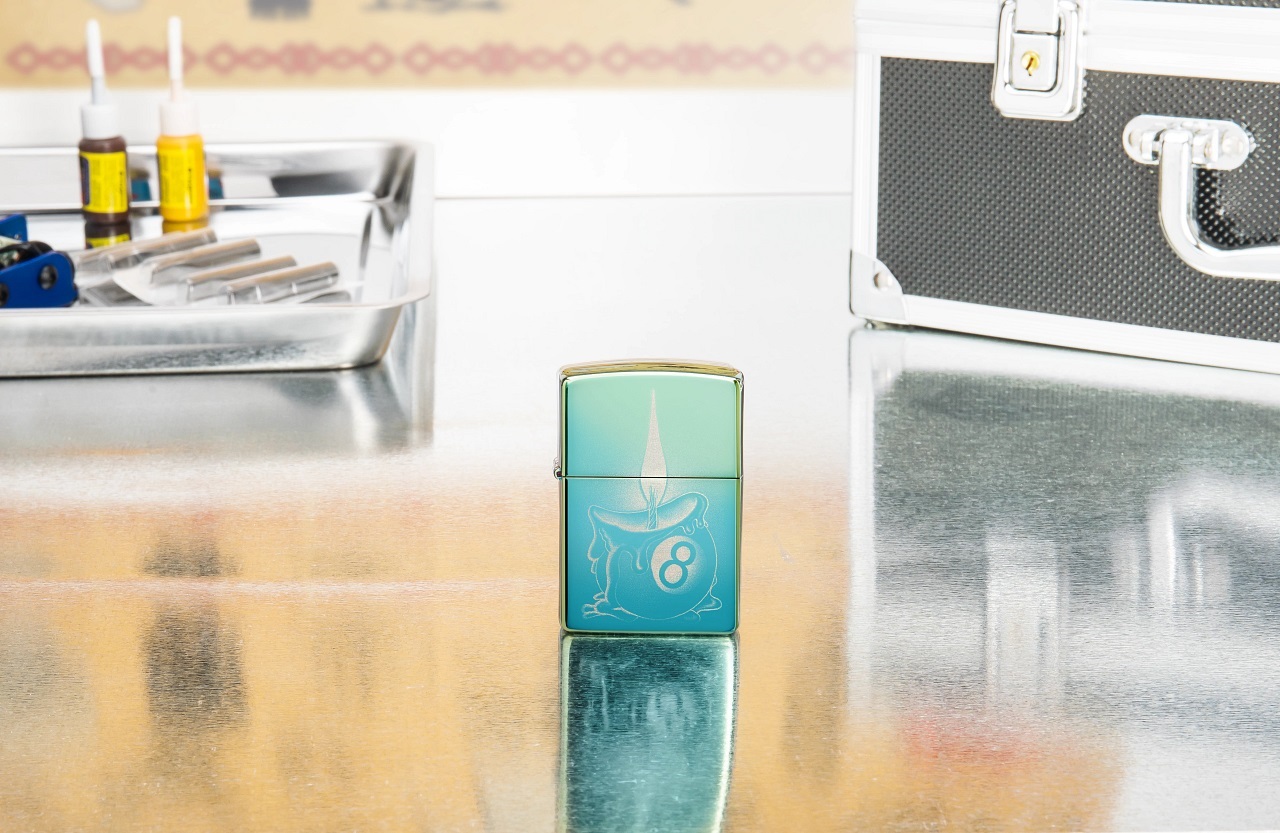 Front shot of Zippo Bejeweled Beetle Design High Polish Brass Windproof Lighter standing at a 3/4 angle.