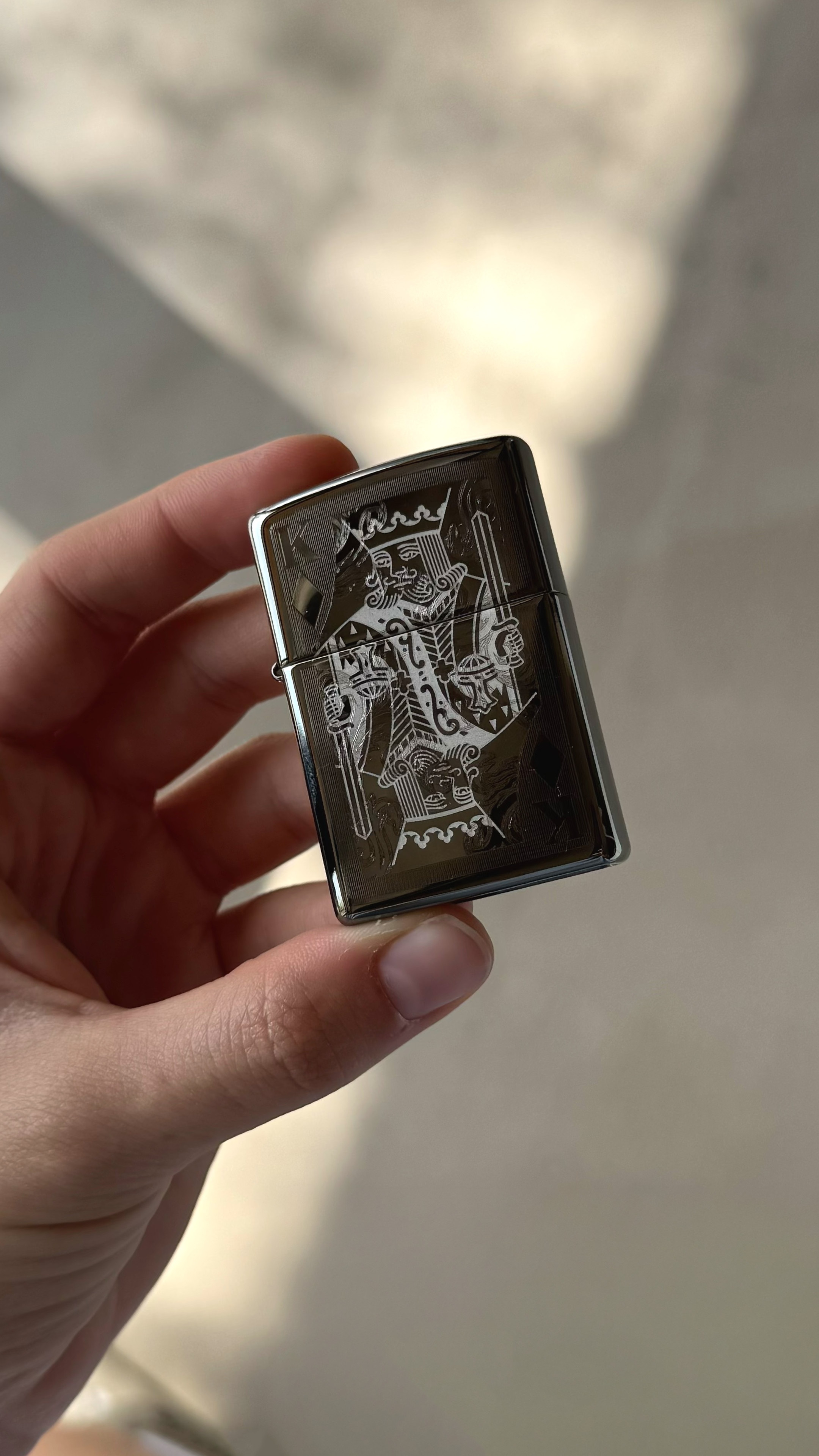 Front shot of Zippo Bejeweled Beetle Design High Polish Brass Windproof Lighter standing at a 3/4 angle.