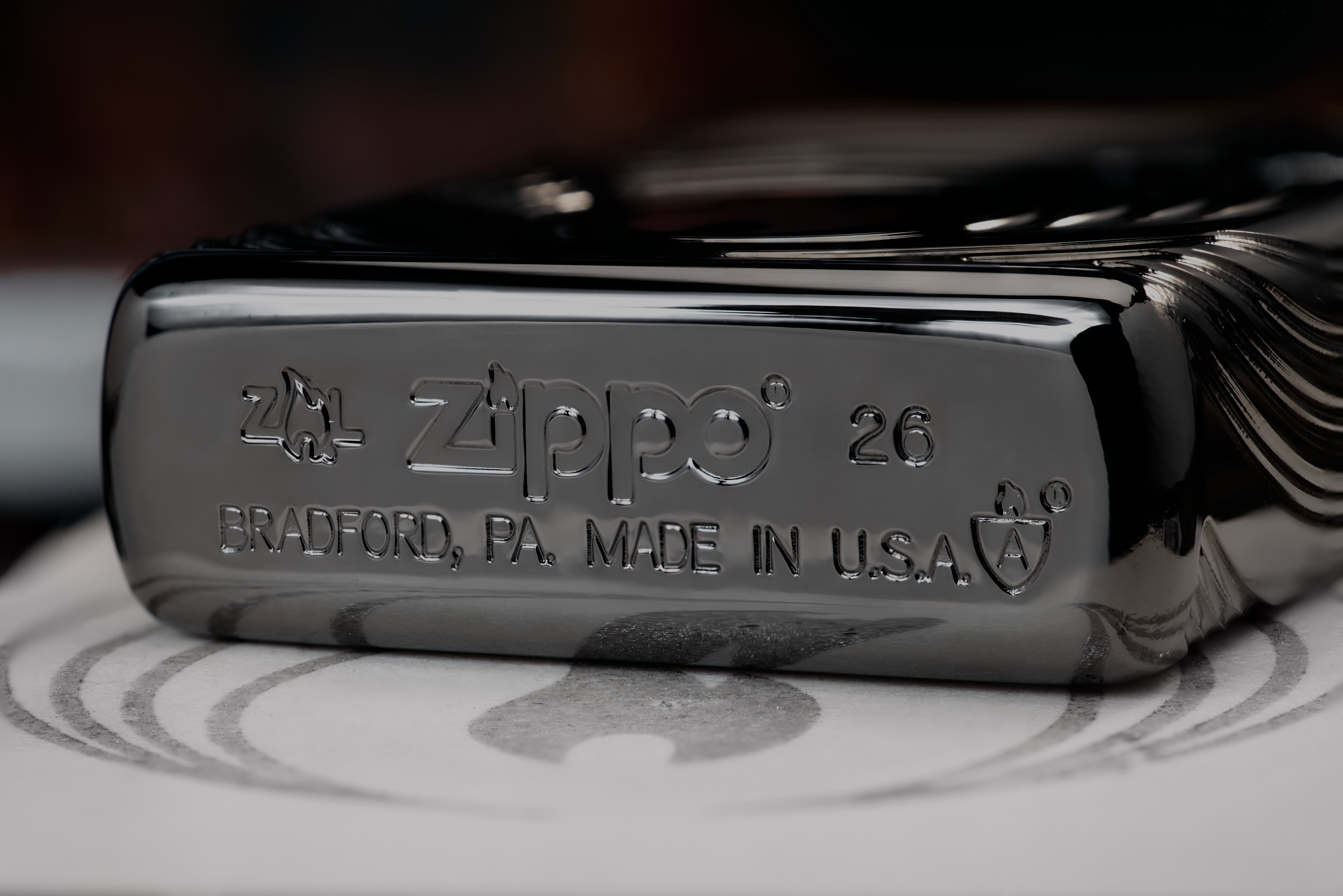 Front shot of Zippo Bejeweled Beetle Design High Polish Brass Windproof Lighter standing at a 3/4 angle.