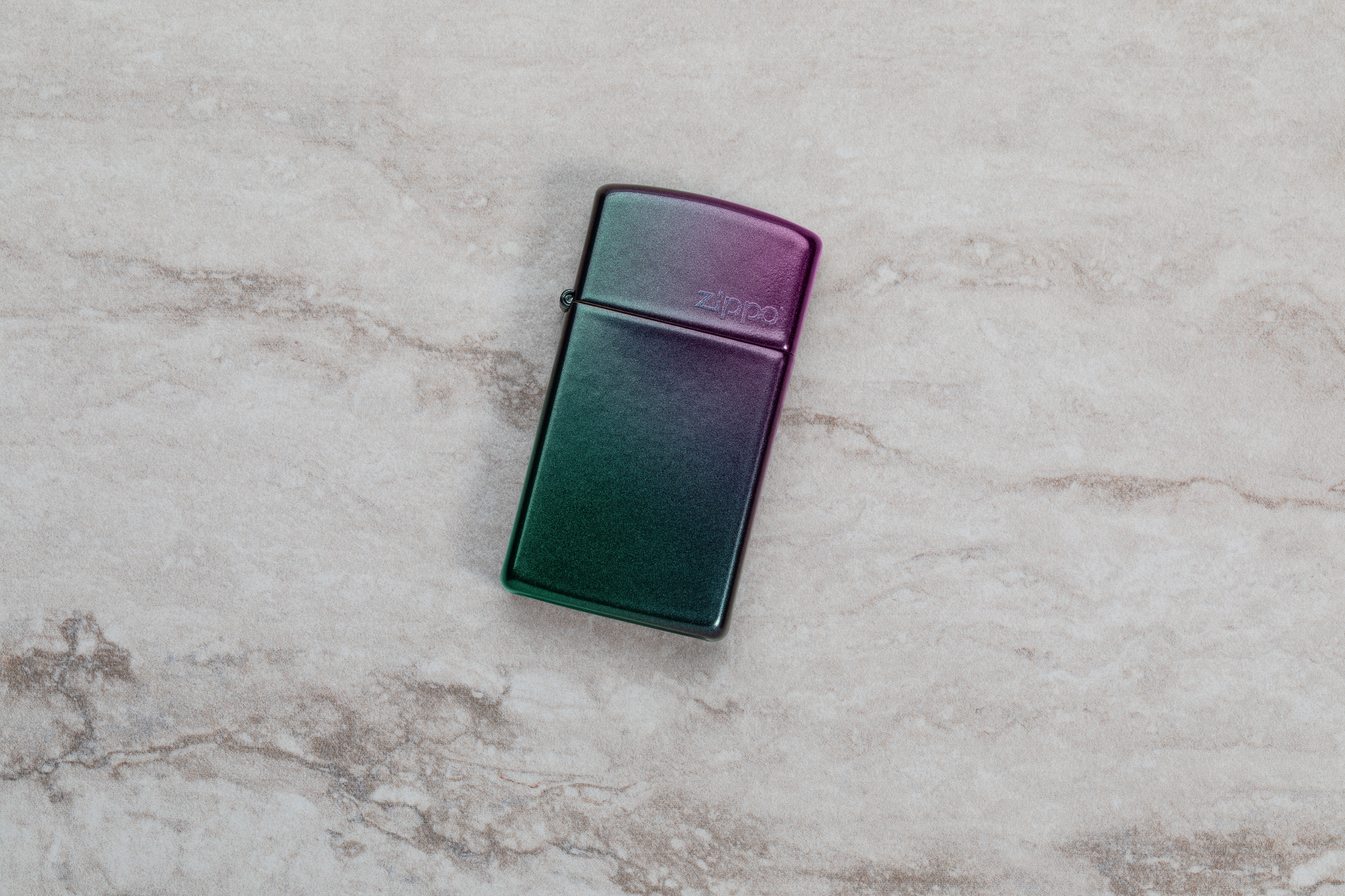 Front shot of Zippo Bejeweled Beetle Design High Polish Brass Windproof Lighter standing at a 3/4 angle.