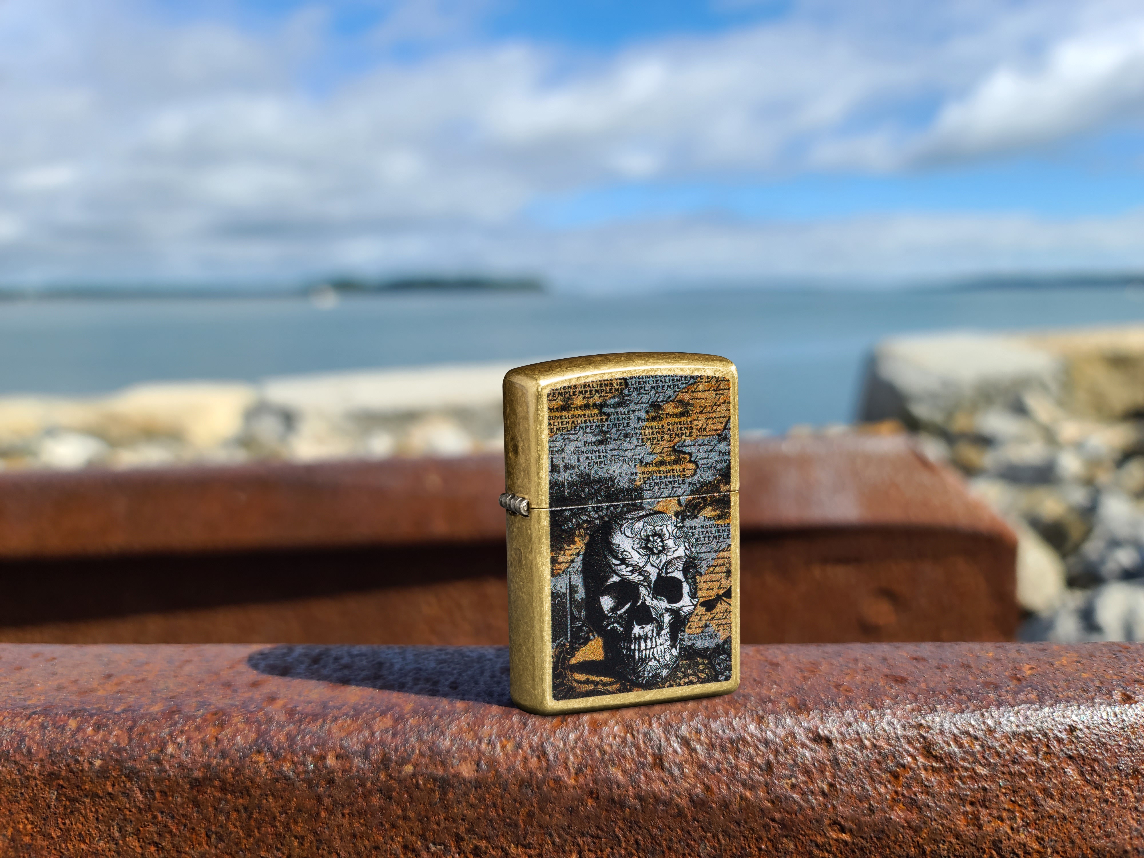 Front shot of Zippo Bejeweled Beetle Design High Polish Brass Windproof Lighter standing at a 3/4 angle.
