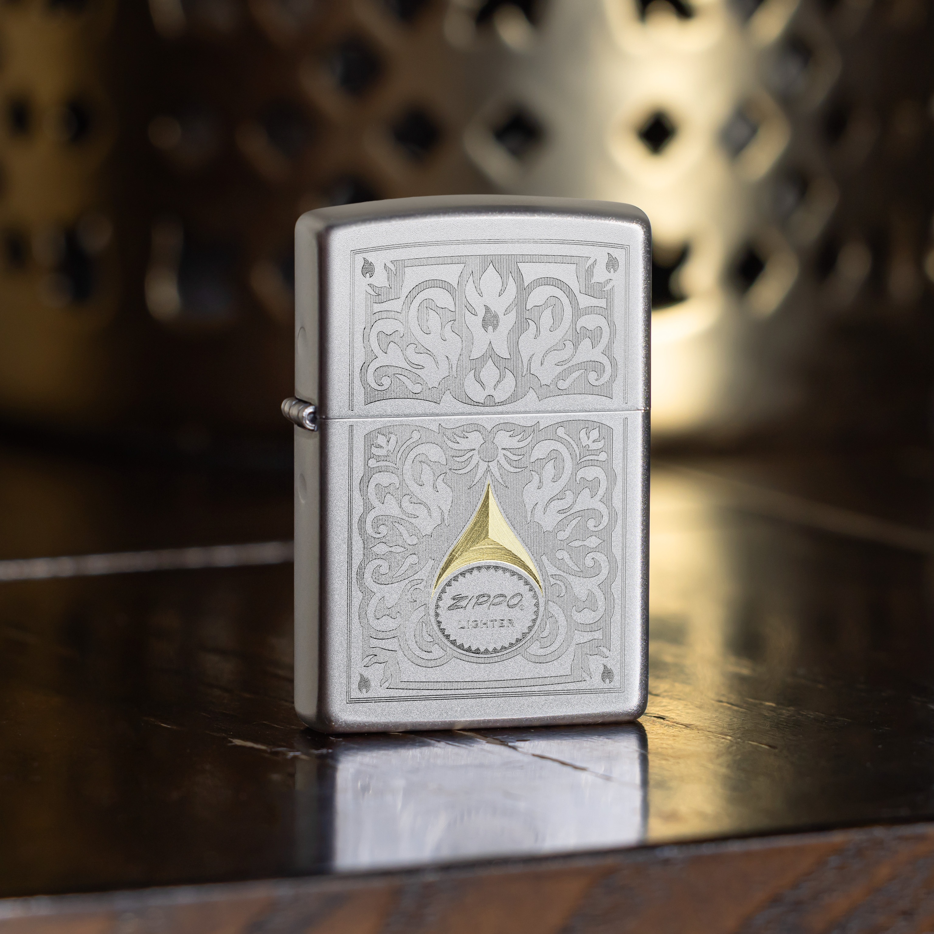 Front shot of Zippo Bejeweled Beetle Design High Polish Brass Windproof Lighter standing at a 3/4 angle.