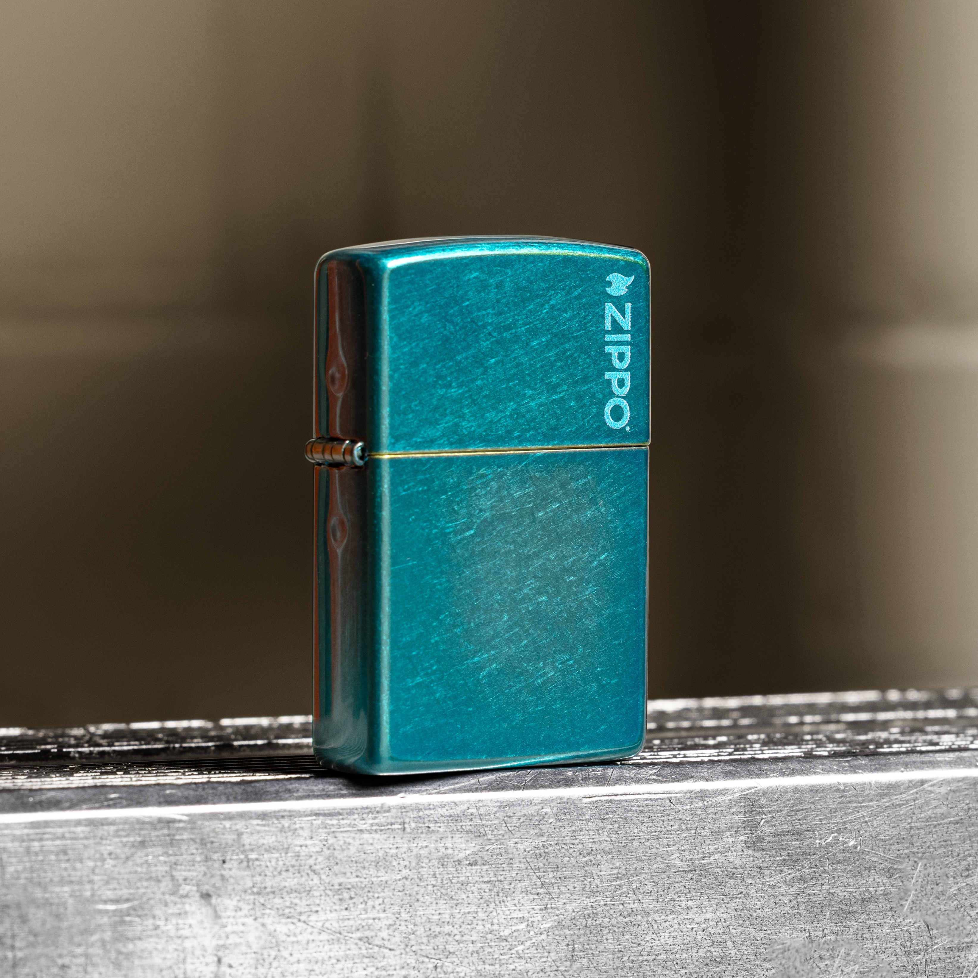 Front shot of Zippo Bejeweled Beetle Design High Polish Brass Windproof Lighter standing at a 3/4 angle.