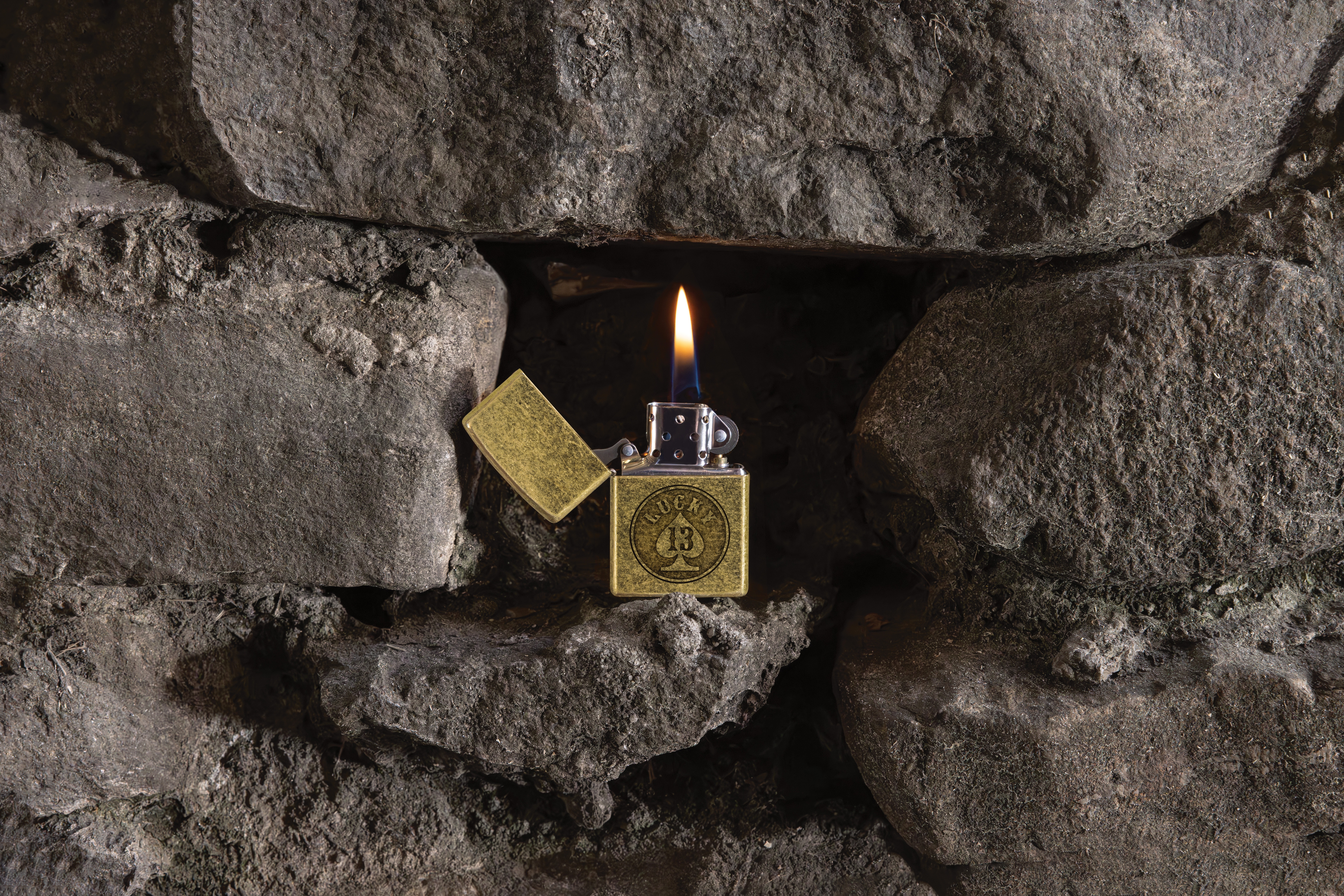 Front shot of Zippo Bejeweled Beetle Design High Polish Brass Windproof Lighter standing at a 3/4 angle.