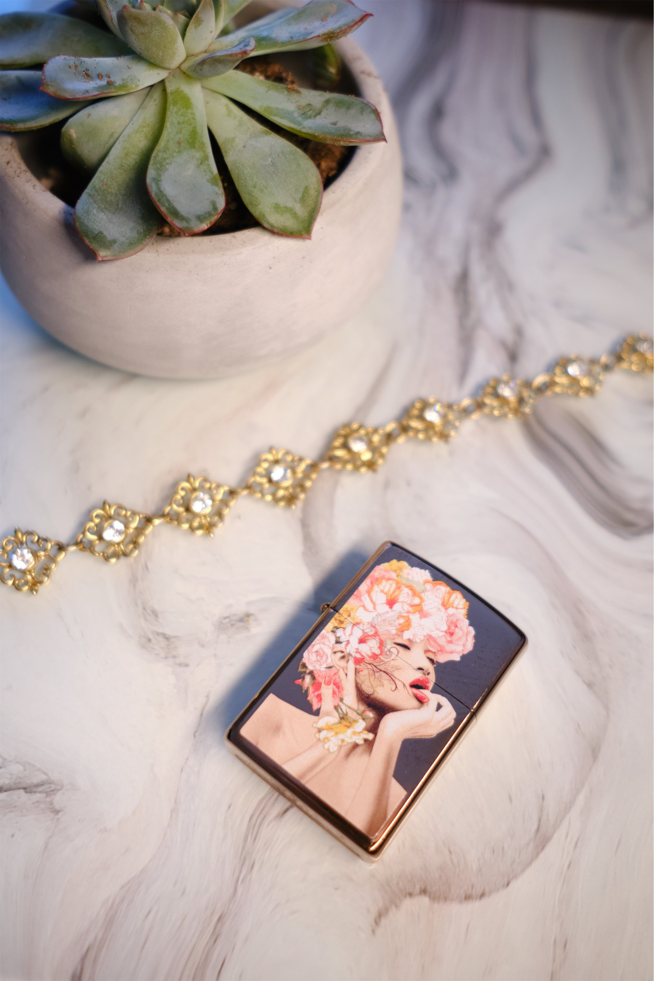 Front shot of Zippo Bejeweled Beetle Design High Polish Brass Windproof Lighter standing at a 3/4 angle.