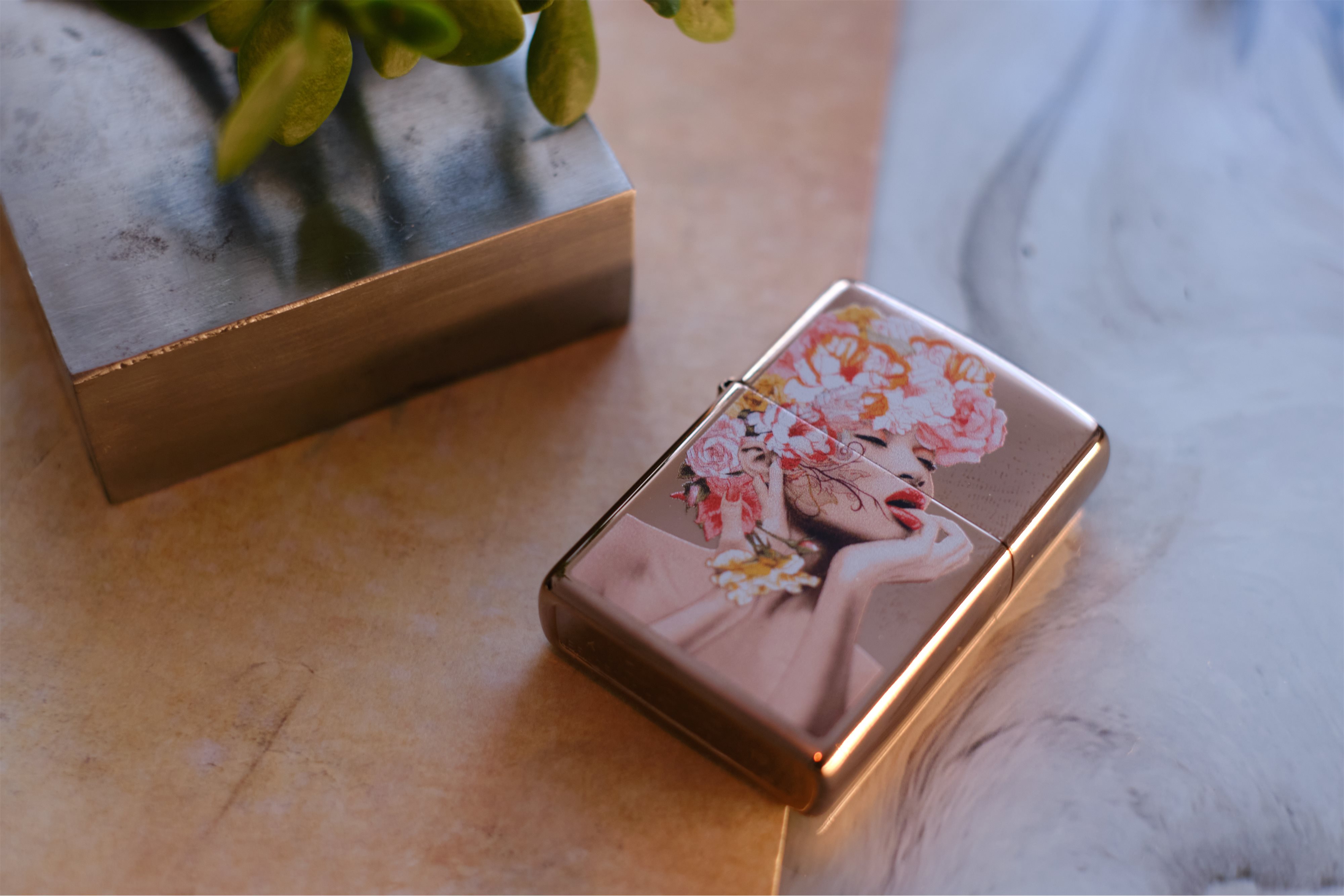 Front shot of Zippo Bejeweled Beetle Design High Polish Brass Windproof Lighter standing at a 3/4 angle.