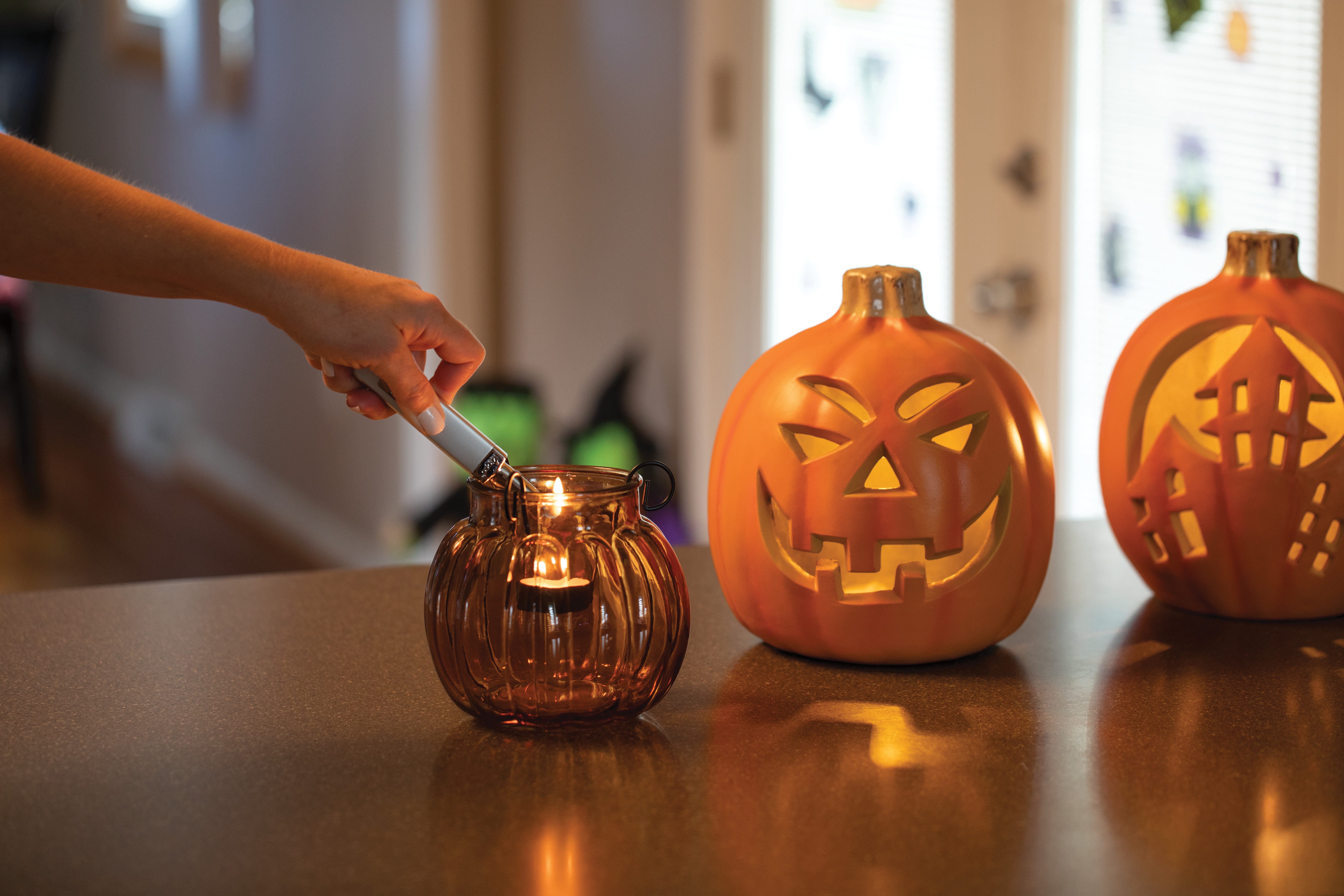 Front shot of Zippo Bejeweled Beetle Design High Polish Brass Windproof Lighter standing at a 3/4 angle.